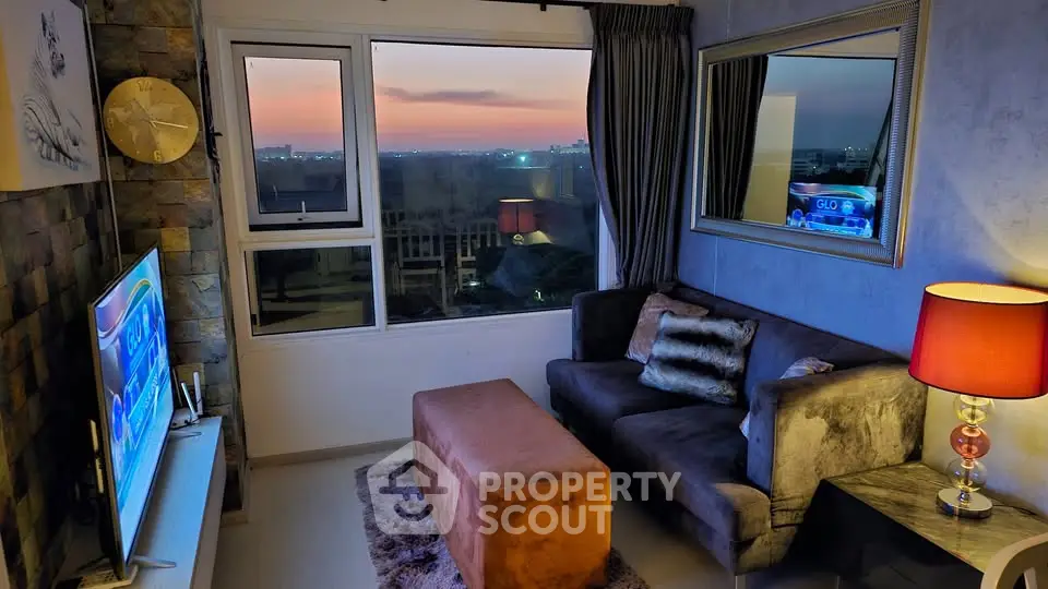Cozy living room with sunset view, plush sofa, and stylish decor