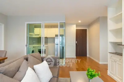 Modern living room with stylish furniture and open kitchen layout