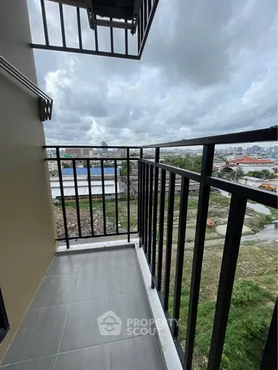 Spacious balcony with city view, perfect for relaxation and enjoying the skyline.