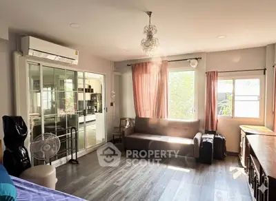 Spacious living room with modern decor and natural light