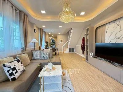 Luxurious living room with elegant chandelier and modern decor