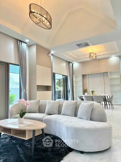 Luxurious modern living room with elegant curved sofa and chic lighting