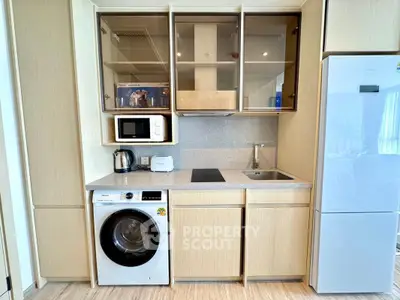 Modern kitchen with integrated appliances and sleek cabinetry