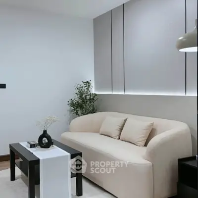 Modern living room with elegant beige sofa and sleek black coffee table