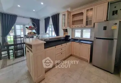 Charming kitchen with elegant cabinetry and modern appliances in a bright, airy home.