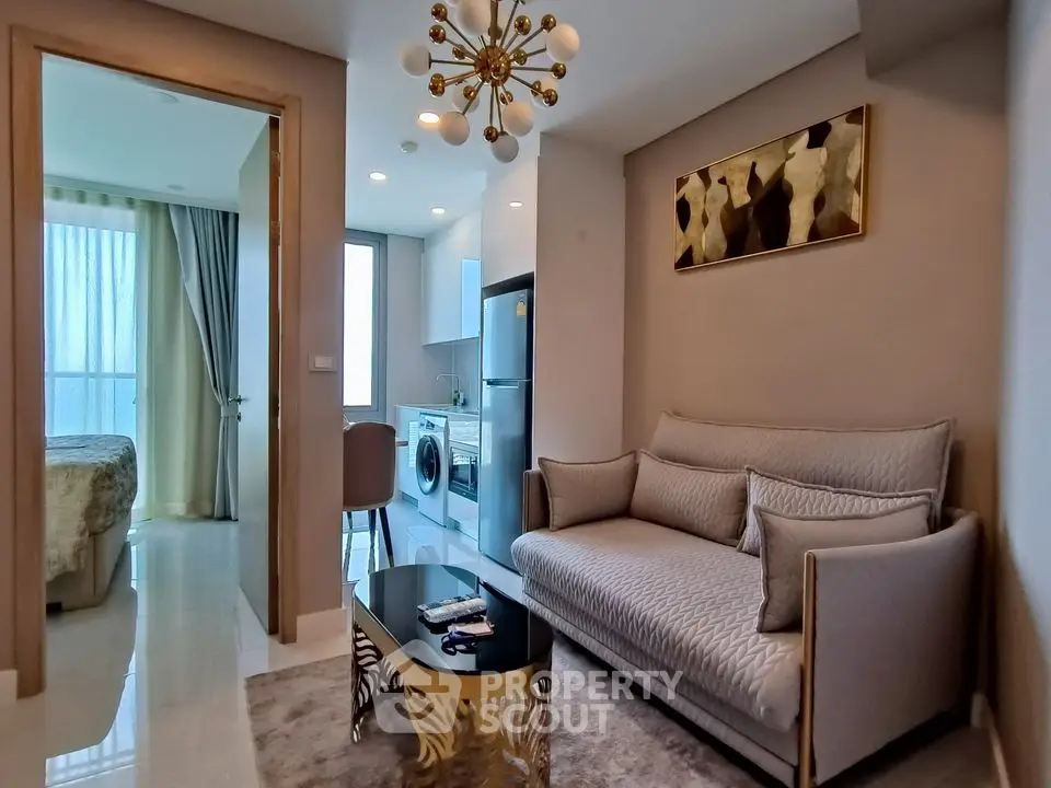 Modern living room with elegant decor and open kitchen layout in luxury apartment