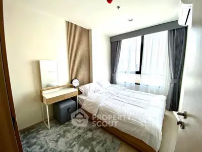 Bright and cozy bedroom with modern decor and large window