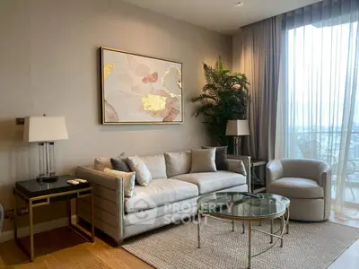 Elegant living room with modern decor, large window, and cozy seating area.