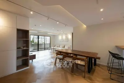 Spacious modern living room with elegant dining area and city view balcony.