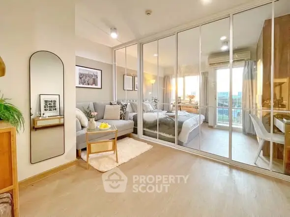 Modern living room with mirrored closet and cozy decor