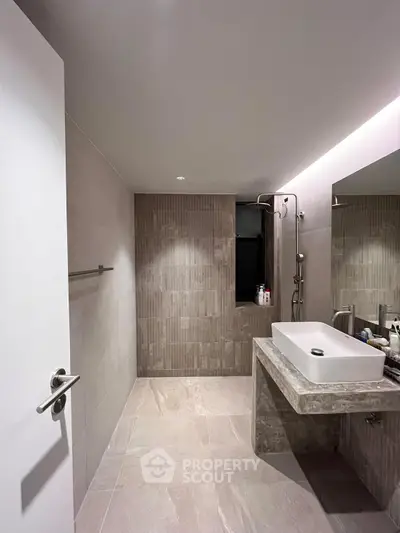 Modern bathroom with sleek design and spacious shower area