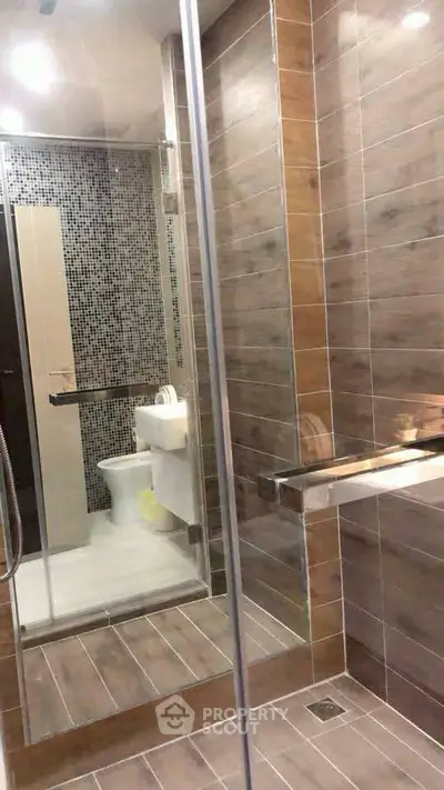 Modern bathroom with glass shower and stylish tile design