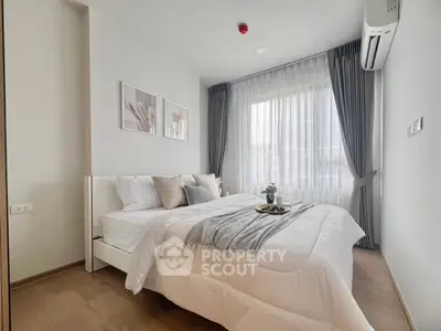 Modern bedroom with elegant decor and natural light