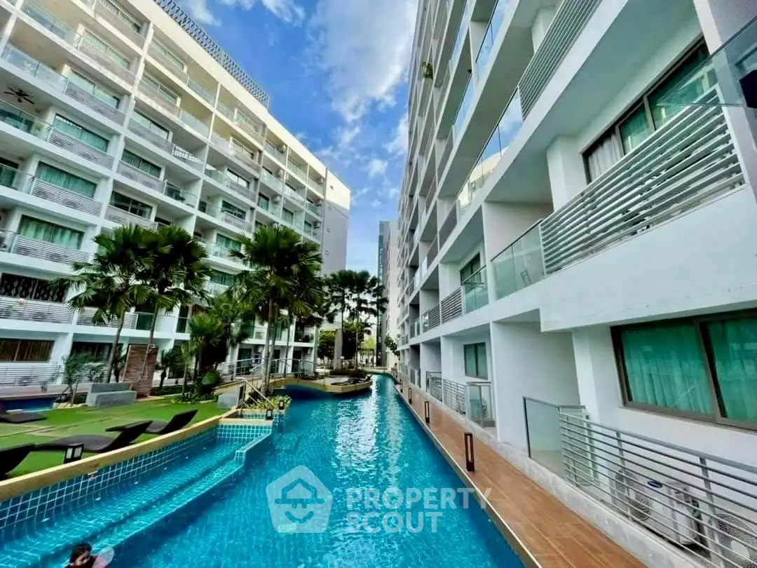 Luxurious apartment complex with stunning pool and modern architecture