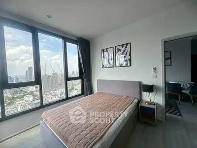 Modern bedroom with stunning city view and stylish decor