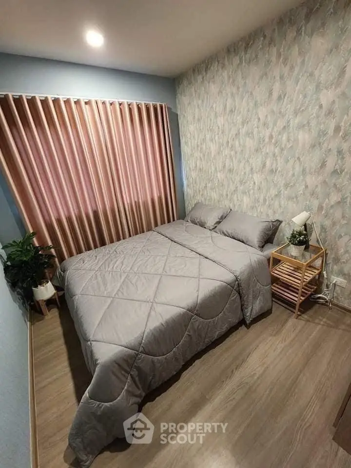 Cozy bedroom with stylish decor and natural light, perfect for relaxation and comfort.