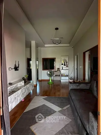 Modern living room with stylish decor and wooden flooring