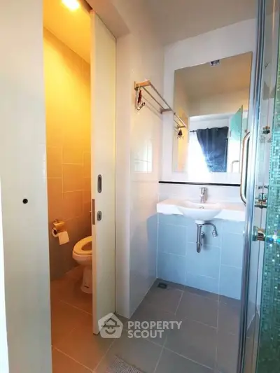 Modern bathroom with sleek design and sliding door
