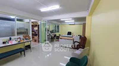 Spacious office interior with modern furniture and bright lighting