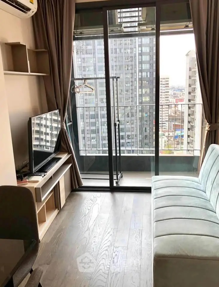 Modern living room with balcony view in high-rise apartment