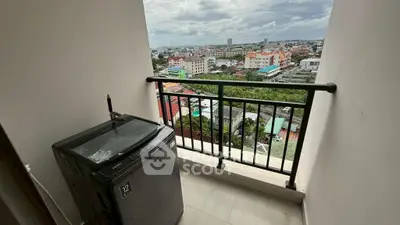 Charming balcony with city view and washing machine, perfect for urban living.