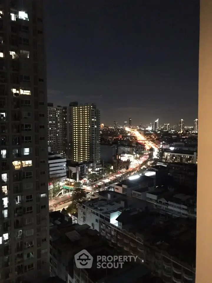 Stunning cityscape night view from high-rise apartment balcony
