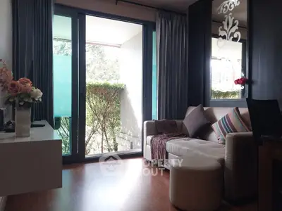 Cozy living room with modern decor and balcony view