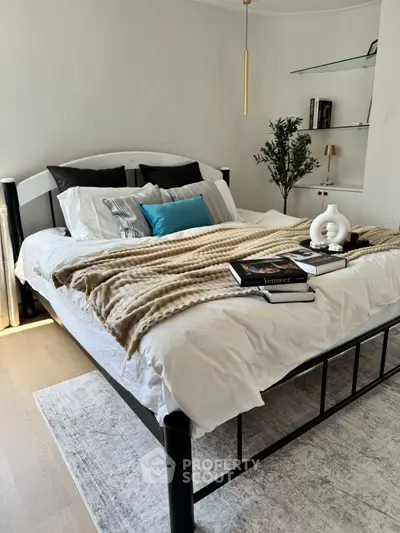 Cozy bedroom with stylish decor and modern furnishings, perfect for relaxation.