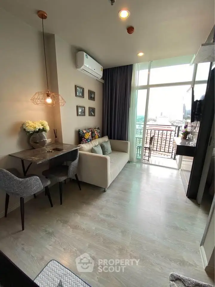 Chic modern living room with stylish decor and city view balcony