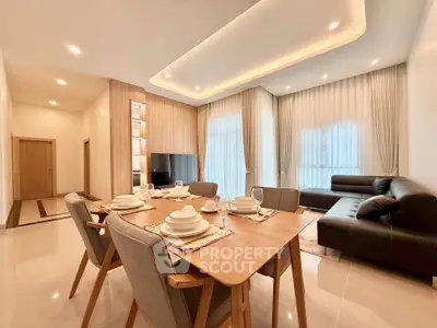 Spacious modern living room with elegant dining area and stylish furniture