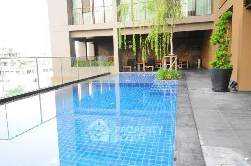 Luxurious rooftop pool with modern design and city views, perfect for relaxation and leisure.