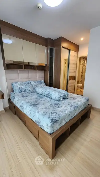 Modern bedroom with stylish wooden bed frame and elegant decor