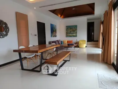 Spacious modern living room with stylish wooden dining table and cozy seating area