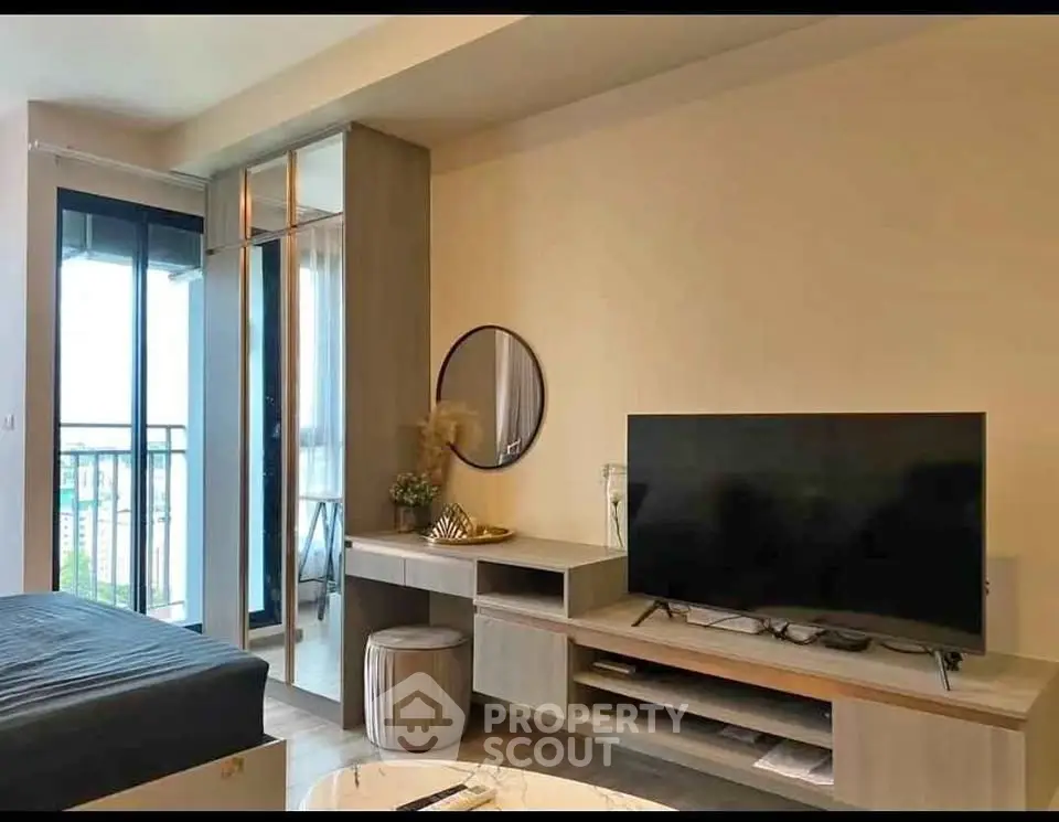 Modern living room with stylish decor and balcony view