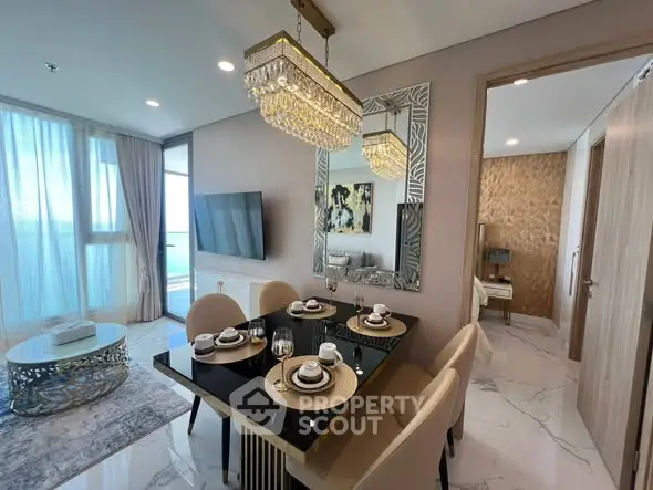 Luxurious modern dining area with elegant chandelier and stylish decor