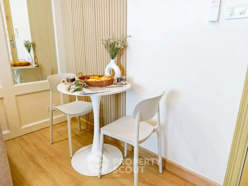 Cozy dining nook with modern table and chairs, perfect for intimate meals.