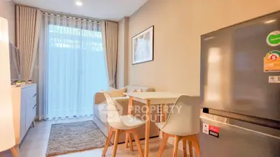 Cozy living room with modern furniture and natural light, perfect for relaxation and entertaining.