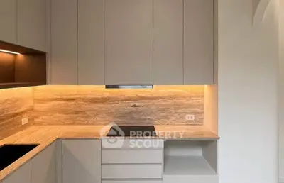 Modern kitchen with sleek cabinetry and built-in cooktop