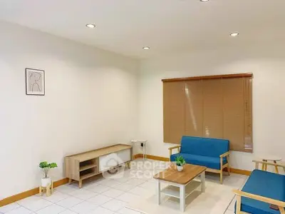 Modern living room with minimalist furniture and natural light