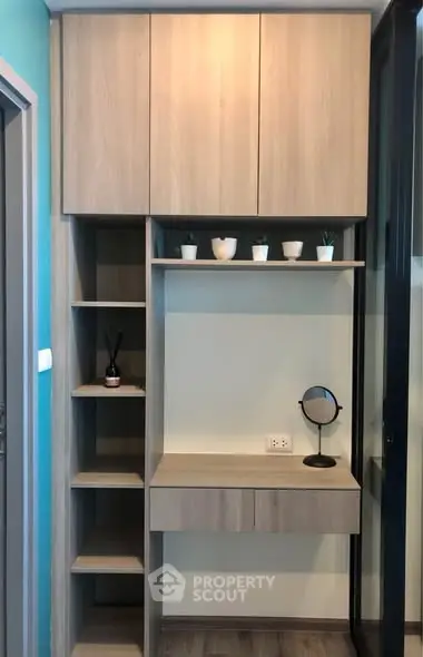 Modern study nook with built-in shelves and desk, ideal for compact spaces.