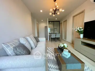 Modern living room with stylish decor and cozy seating area in a contemporary apartment.