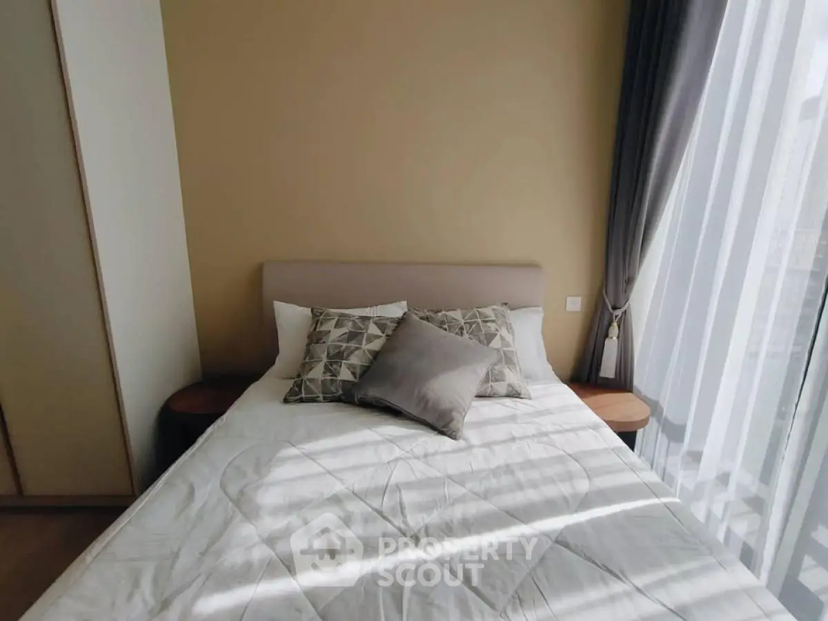 Cozy bedroom with natural light and stylish decor