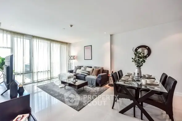 Spacious modern living room with elegant dining area and abundant natural light.