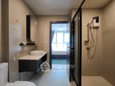Modern bathroom with sleek fixtures and spacious shower area