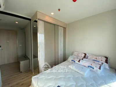 Modern bedroom with sleek wardrobe and cozy bed in a stylish apartment
