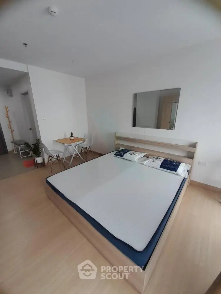 Modern bedroom with minimalist decor and cozy ambiance