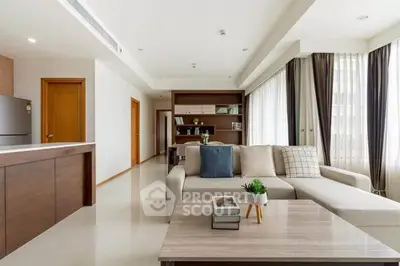 Spacious modern living room with elegant decor and abundant natural light