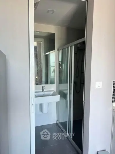 Modern bathroom with sleek shower and minimalist sink design