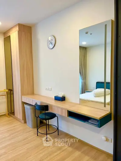 Modern bedroom with stylish vanity and large mirror