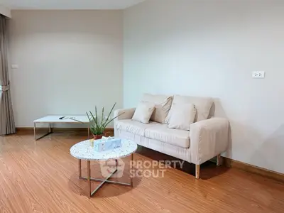 Modern minimalist living room with beige sofa and stylish coffee table